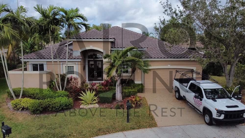 South Florida home with brown concrete tile roofing repairs by Kairos Roofing