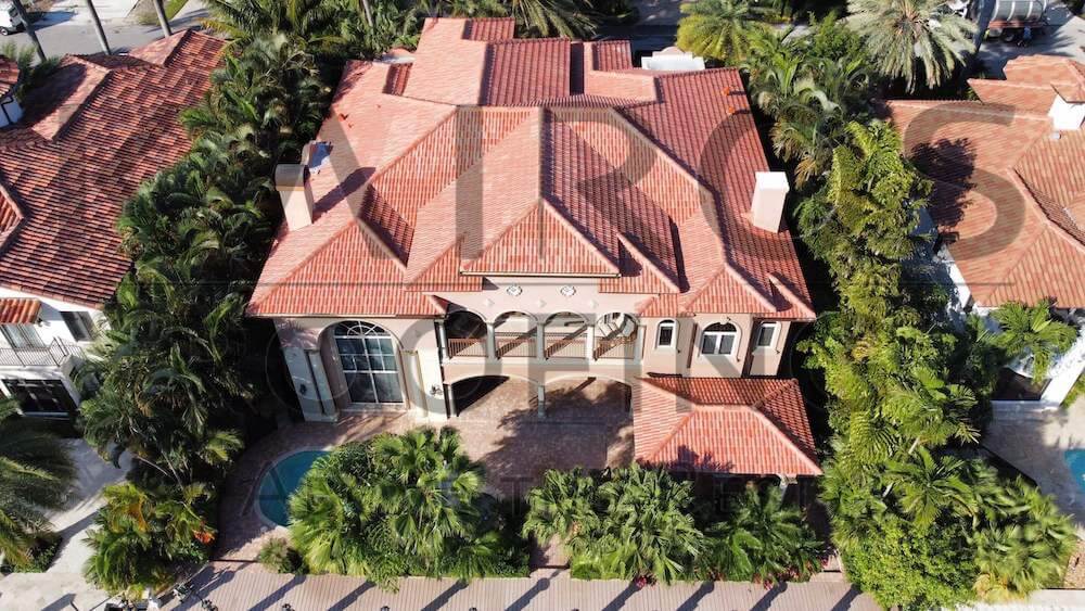 South Florida residential home with orange concrete tiles by Kairos Roofing