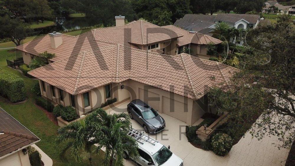 South Florida home that needed a roof replacement with slight brown concrete tiles