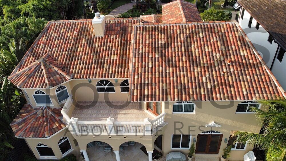 roof replacement for south florida home with clay tile mixed orange and brown colors