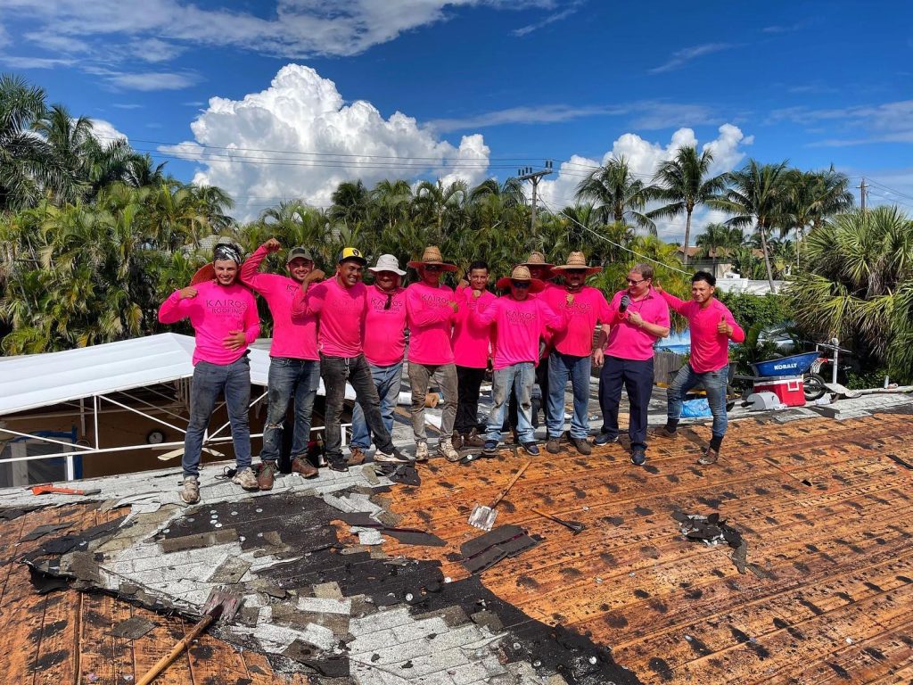Kairos Roofing Celebrating teamwork on the roof of a Miramar, FL home roof replacement